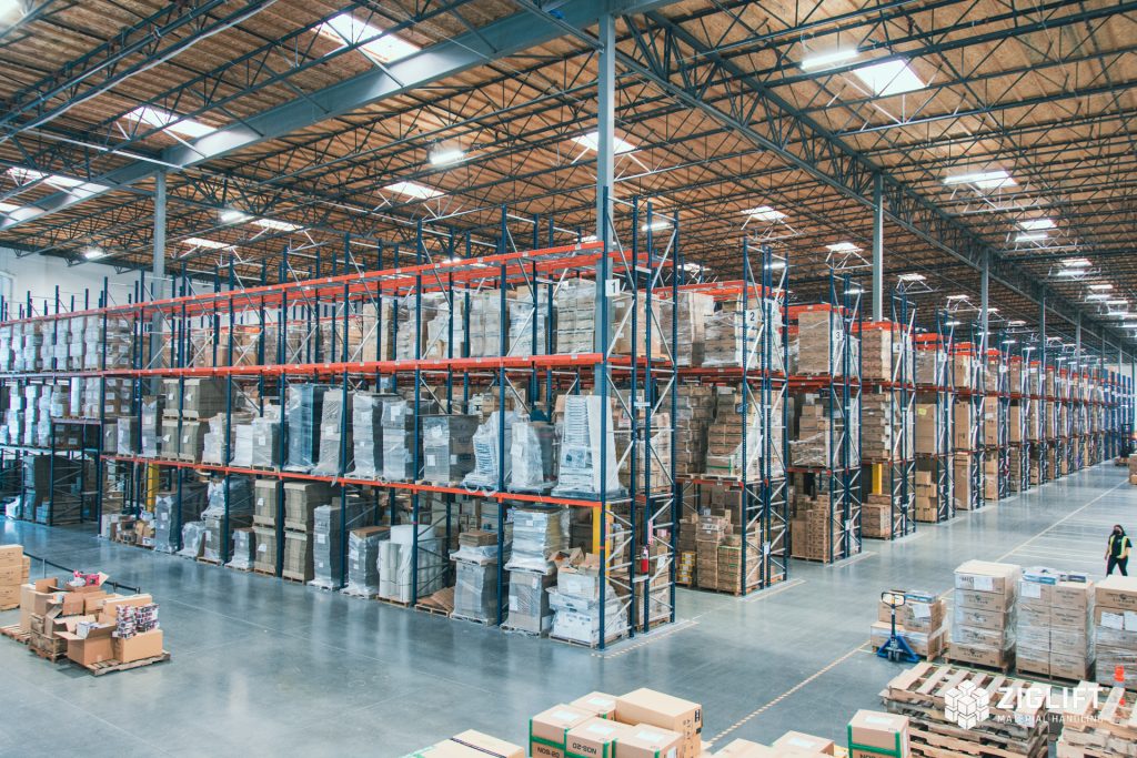 Rows of industrial pallet racks loaded with pallets in a Kansas City warehouse